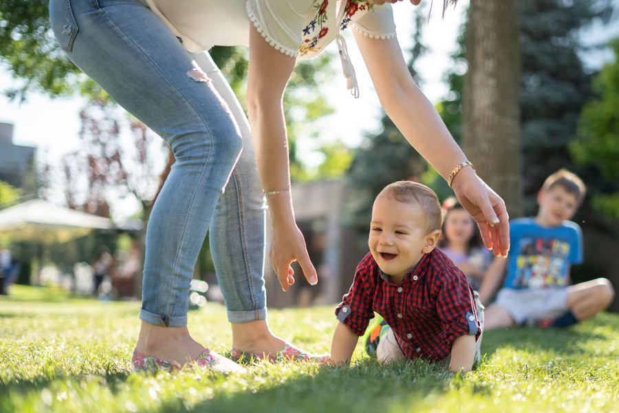 Baby crawling in grass | Life & Annuities | Johnson-Stone